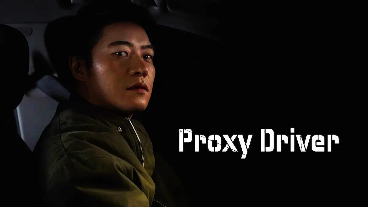 Action thriller drama poster featuring an intense male driver looking over his shoulder against a dark backdrop