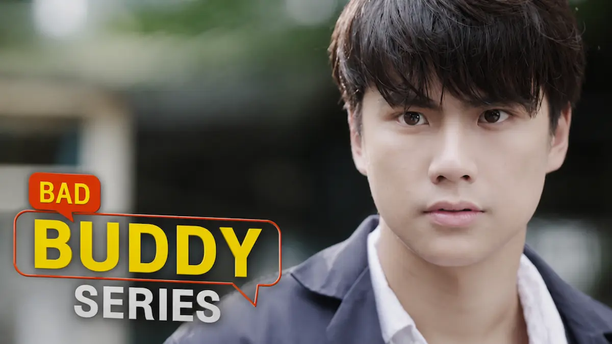 Thai BL romance drama still featuring a young man with dark hair looking directly at the camera with text on the left