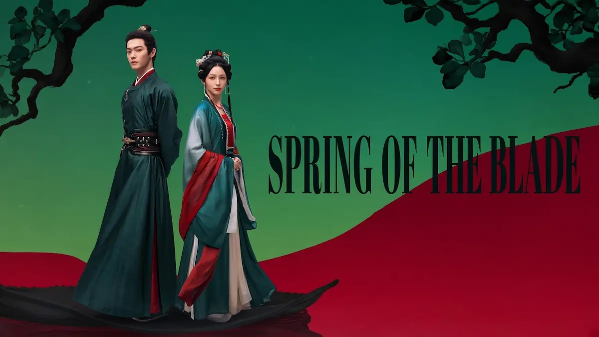 A man and woman in traditional dark green and red Hanfu attire standing in front of a green and red split background with tree branches